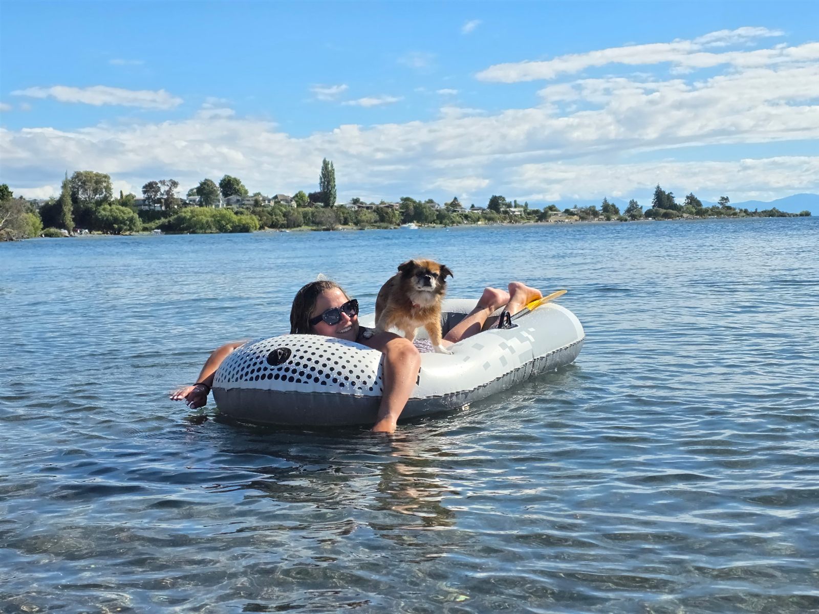 Hope floating on Lake Taupō with her dog